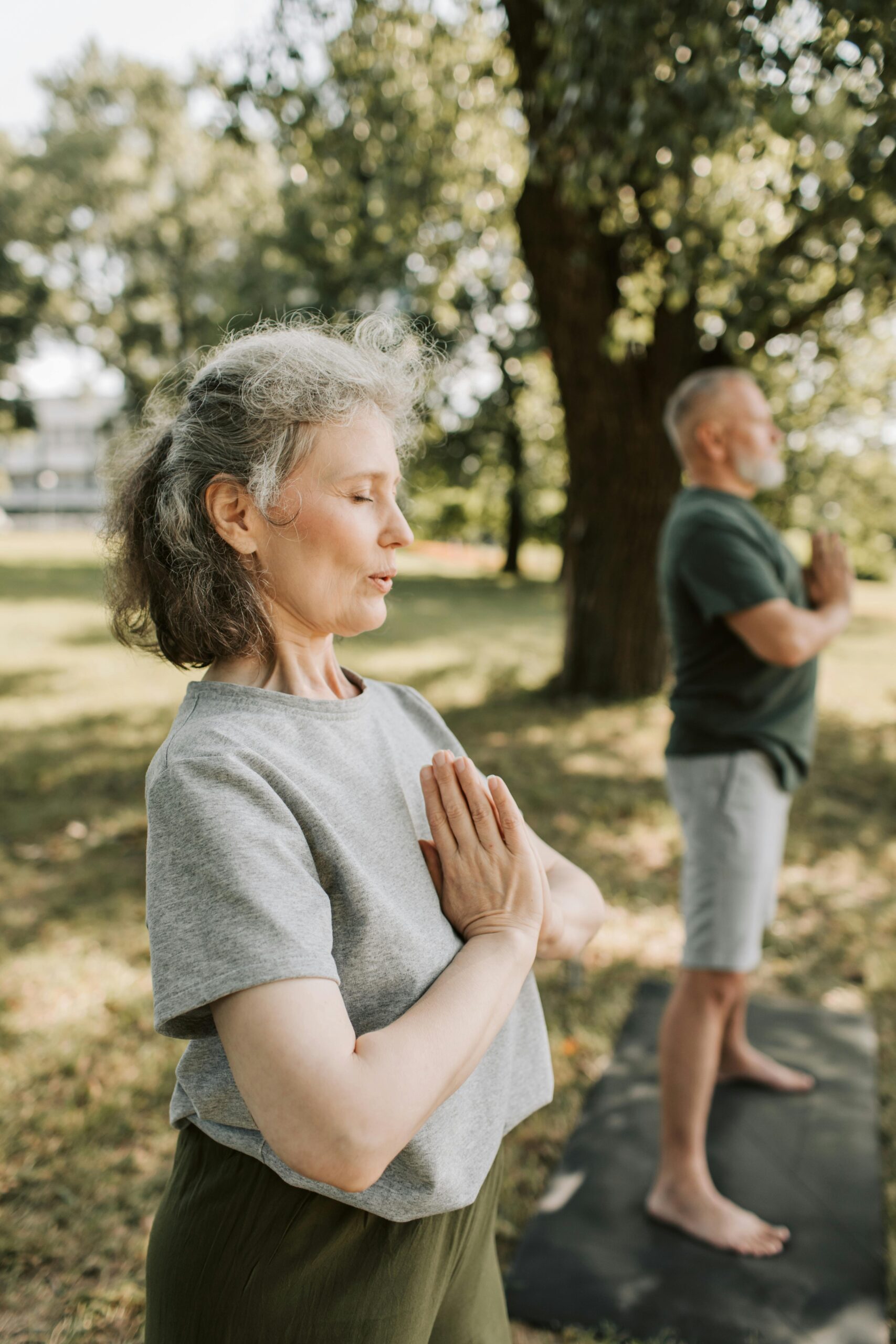 Man in Green Crew Neck T-shirt Doing Siddhasana Pose